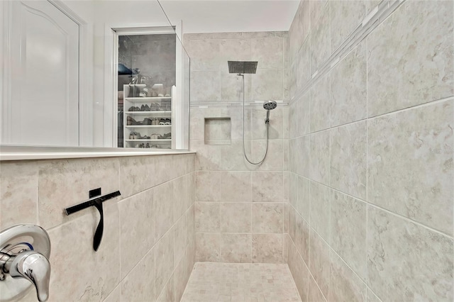 bathroom with tiled shower