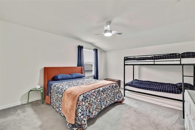 carpeted bedroom featuring ceiling fan and lofted ceiling