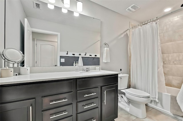 full bathroom featuring toilet, tile patterned flooring, shower / tub combo, and vanity