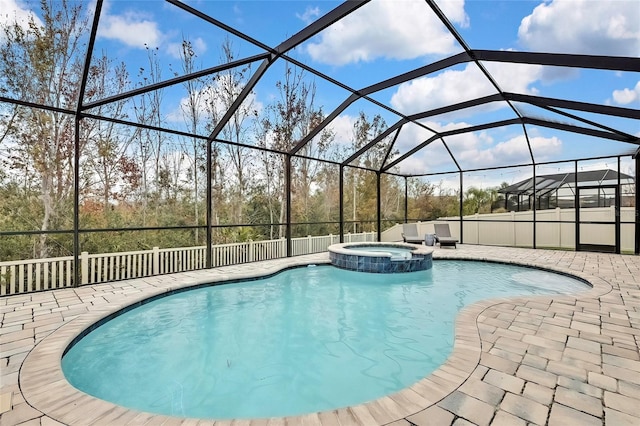 view of swimming pool with a lanai, a patio, and an in ground hot tub