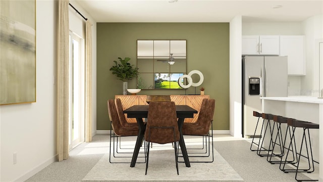 dining room featuring light colored carpet