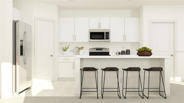 kitchen featuring range, light colored carpet, stainless steel fridge, a breakfast bar, and white cabinets