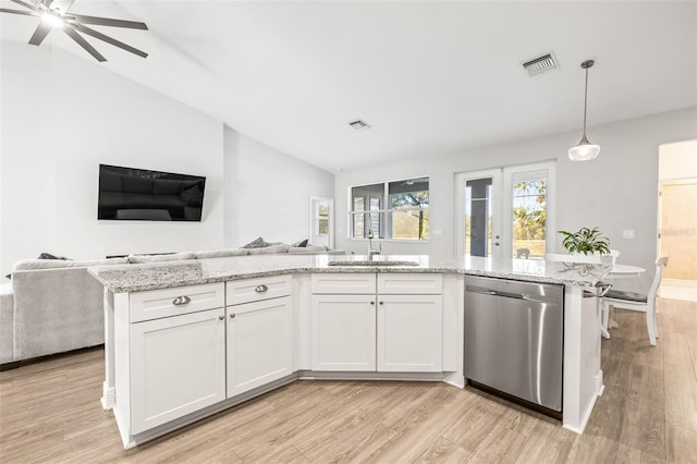 kitchen with dishwasher, decorative light fixtures, white cabinetry, sink, and vaulted ceiling