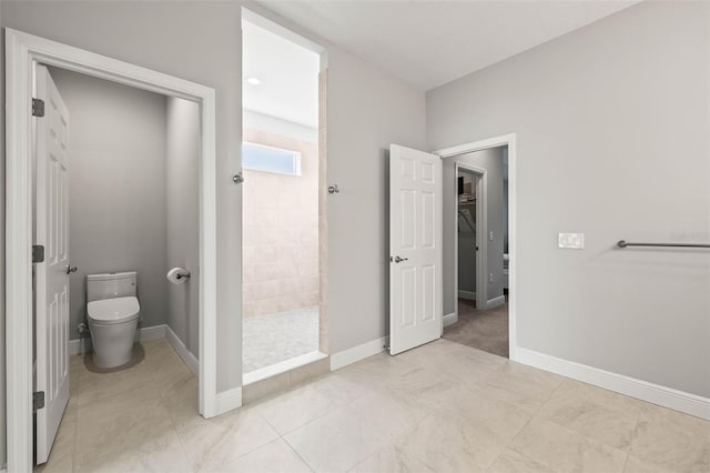 bathroom featuring toilet and a shower