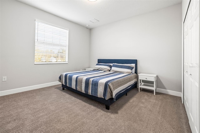 bedroom featuring a closet and carpet flooring