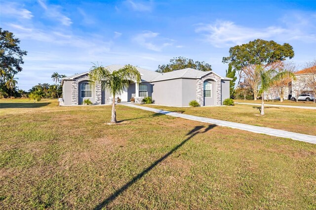 ranch-style house featuring a front lawn