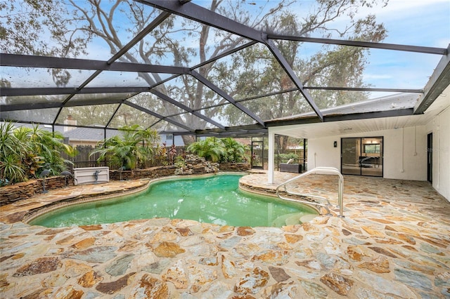 view of pool featuring a lanai and a patio area