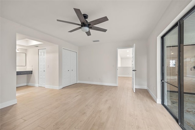 spare room with ceiling fan and light hardwood / wood-style floors