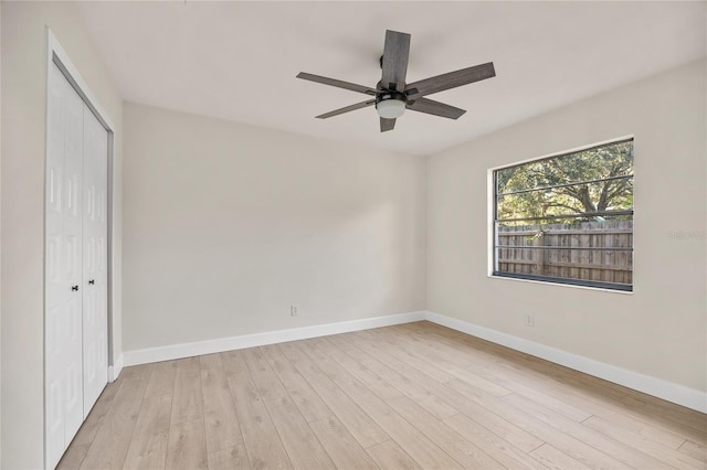 spare room featuring ceiling fan and light hardwood / wood-style floors