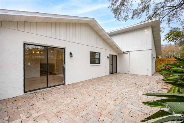 back of property featuring a patio area