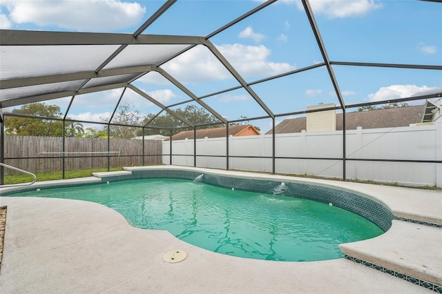 view of swimming pool with a lanai, a patio, and pool water feature