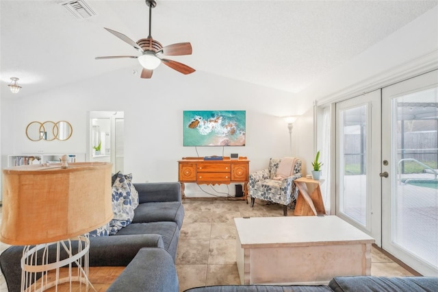 living room with lofted ceiling, french doors, and ceiling fan