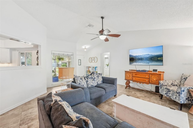 living room with ceiling fan and vaulted ceiling