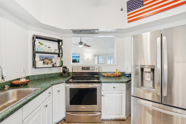 kitchen with white cabinets, appliances with stainless steel finishes, ceiling fan, and sink