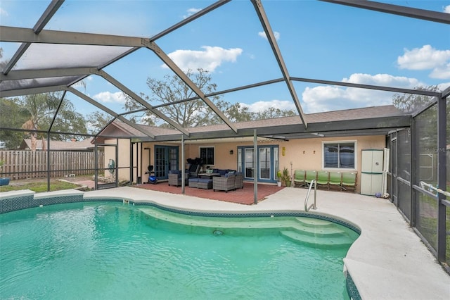 view of swimming pool featuring an outdoor hangout area, a lanai, and a patio