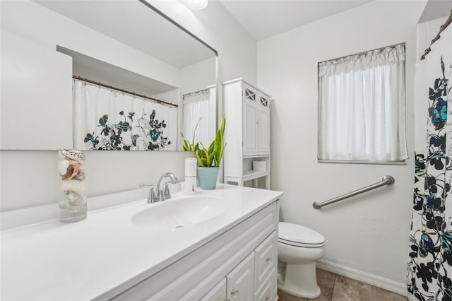 bathroom featuring toilet and vanity