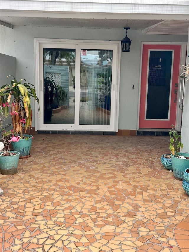 entrance to property with a patio area