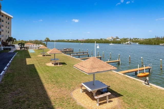 19451 Gulf Blvd Unit 204, Indian Shores, FL 33785 - dock area with a lawn and a water view