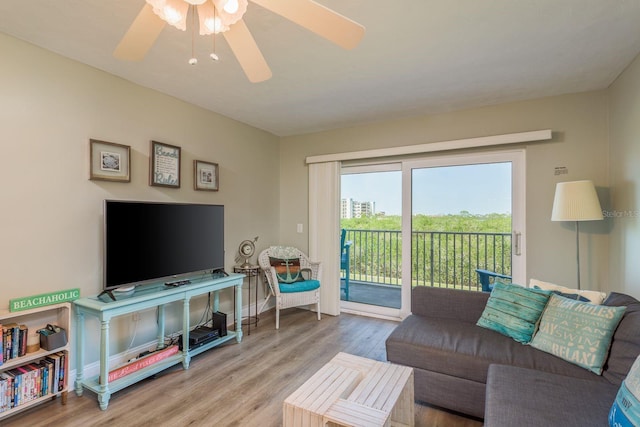 19451 Gulf Blvd Unit 204, Indian Shores, FL 33785 - living room featuring baseboards, a ceiling fan, and wood finished floors