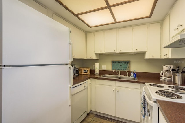 19451 Gulf Blvd Unit 204, Indian Shores, FL 33785 - kitchen with dark countertops, white appliances, a sink, and under cabinet range hood