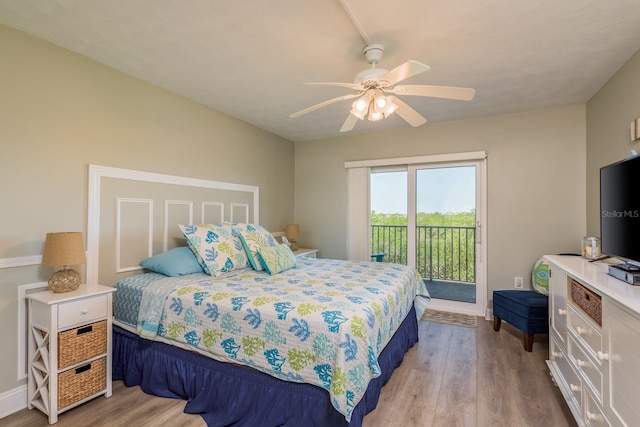 19451 Gulf Blvd Unit 204, Indian Shores, FL 33785 - bedroom featuring wood finished floors, a ceiling fan, baseboards, and access to outside
