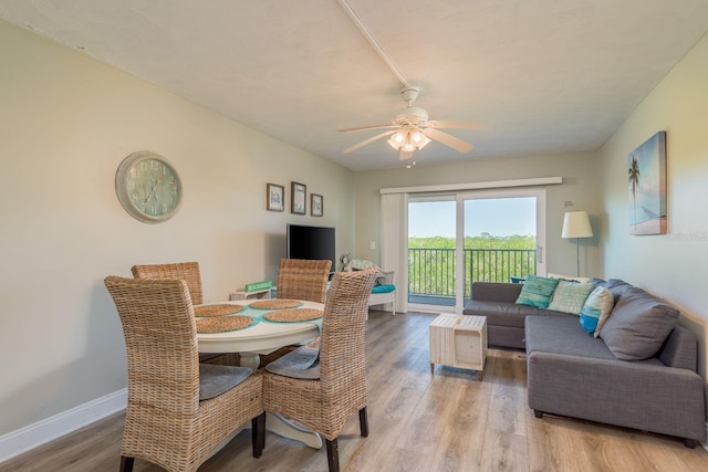 19451 Gulf Blvd Unit 204, Indian Shores, FL 33785 - dining room with wood finished floors, baseboards, and ceiling fan