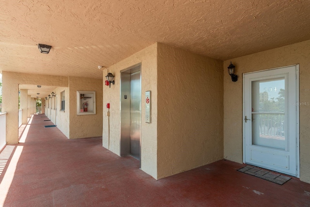 19451 Gulf Blvd Unit 204, Indian Shores, FL 33785 - property entrance with elevator and stucco siding