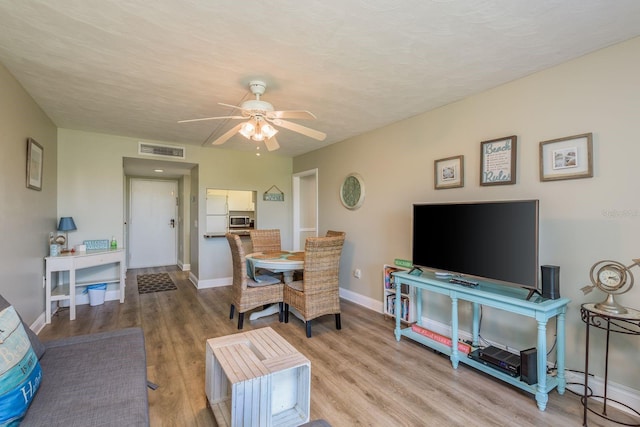 19451 Gulf Blvd Unit 204, Indian Shores, FL 33785 - living room with ceiling fan, baseboards, wood finished floors, and visible vents