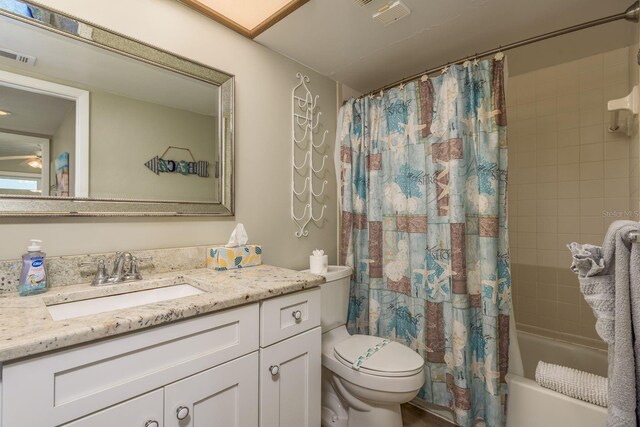 19451 Gulf Blvd Unit 204, Indian Shores, FL 33785 - bathroom featuring shower / tub combo with curtain, visible vents, toilet, and vanity