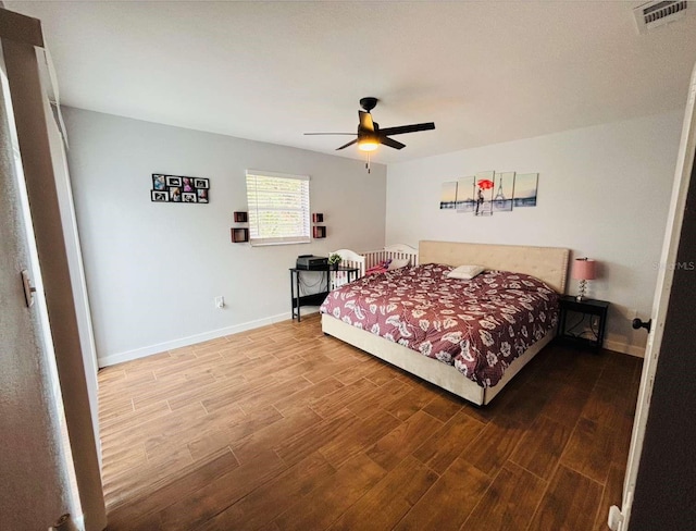 bedroom featuring ceiling fan and hardwood / wood-style floors