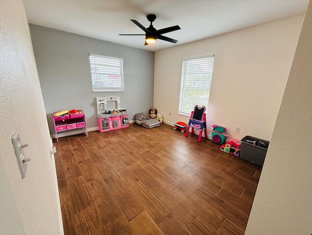 rec room with wood-type flooring and ceiling fan