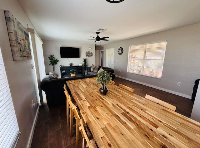 dining space featuring ceiling fan and hardwood / wood-style flooring