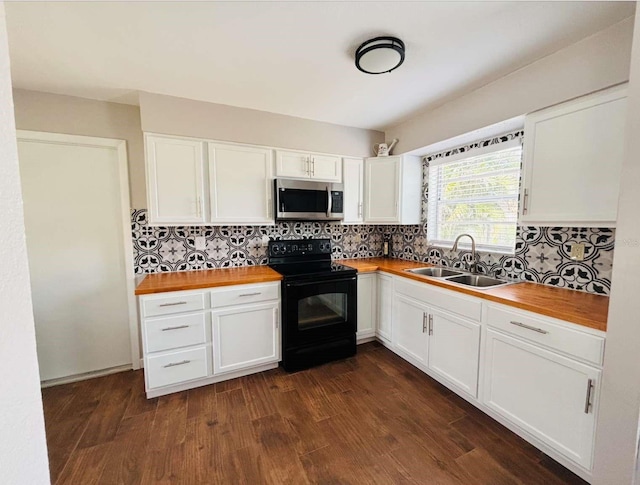 kitchen featuring sink, wooden counters, white cabinets, and black electric range oven