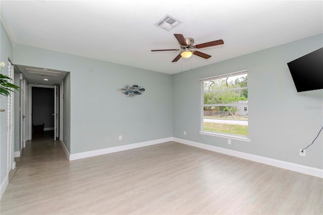 empty room with ceiling fan and light wood-type flooring