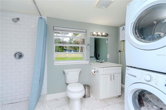 bathroom with vanity, stacked washer and clothes dryer, walk in shower, and toilet