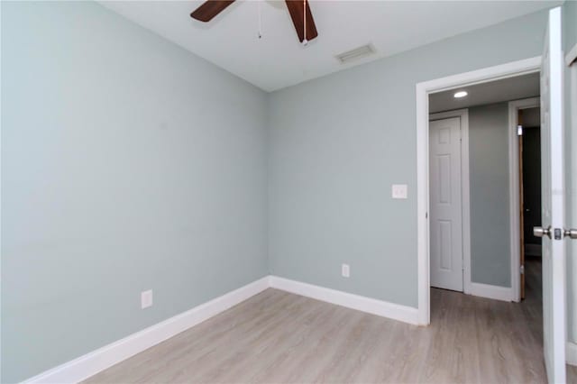 spare room featuring light wood-type flooring