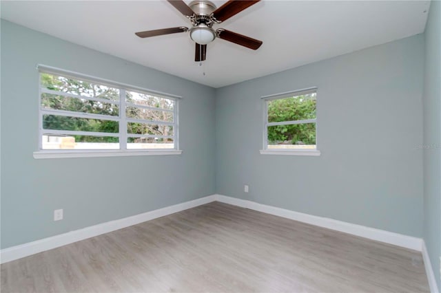 spare room with ceiling fan and light hardwood / wood-style flooring