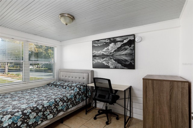 bedroom featuring light tile patterned floors