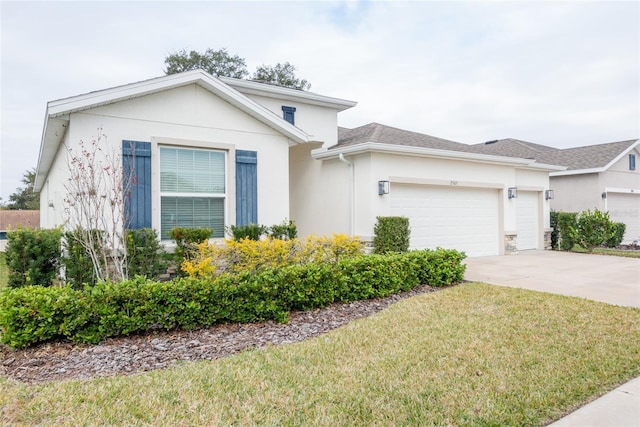 view of front facade with a front lawn and a garage