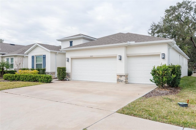 view of front of home with a front lawn and a garage