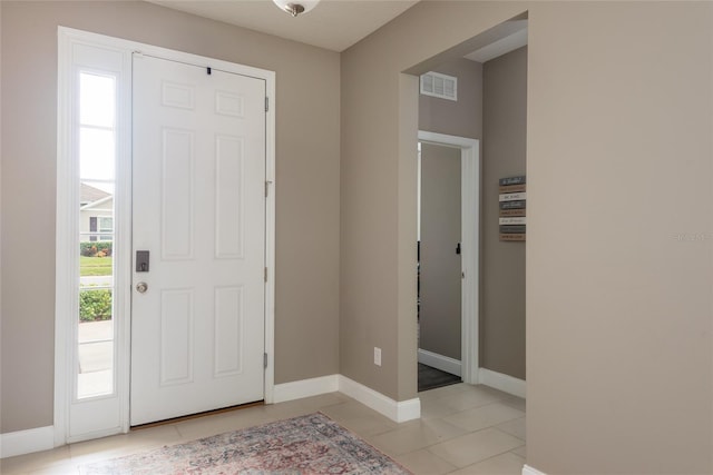 foyer entrance featuring light tile patterned floors