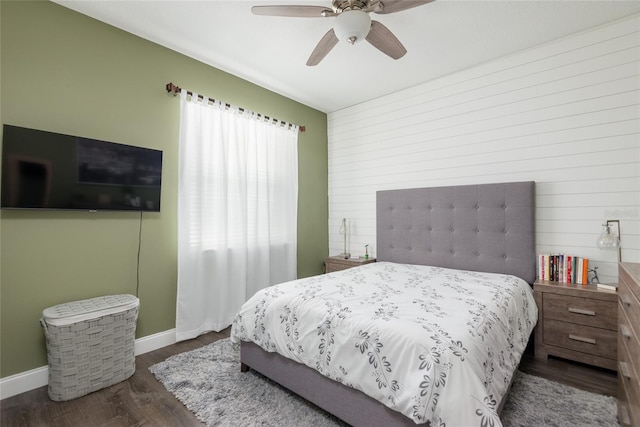 bedroom with ceiling fan and dark hardwood / wood-style floors