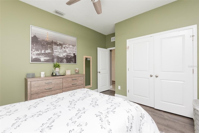 bedroom with ceiling fan, hardwood / wood-style floors, and a closet