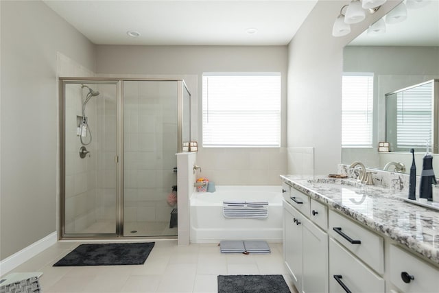 bathroom with vanity, tile patterned flooring, and shower with separate bathtub