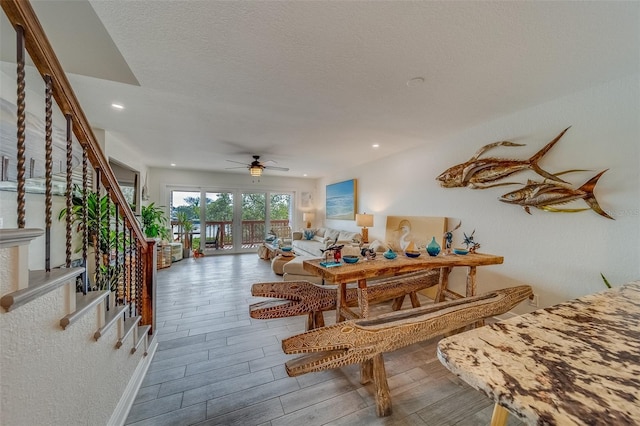 dining space featuring a textured ceiling and ceiling fan