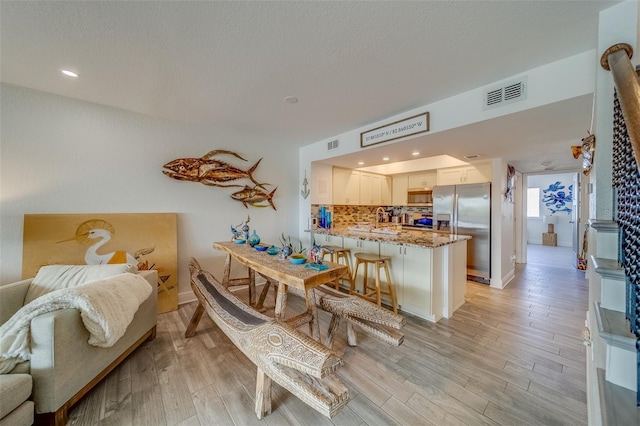 dining area featuring light hardwood / wood-style floors