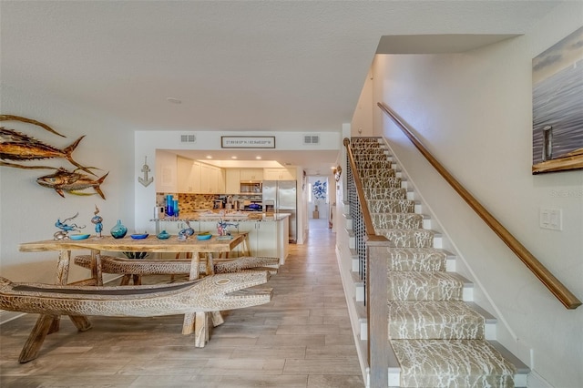 dining room featuring light hardwood / wood-style flooring