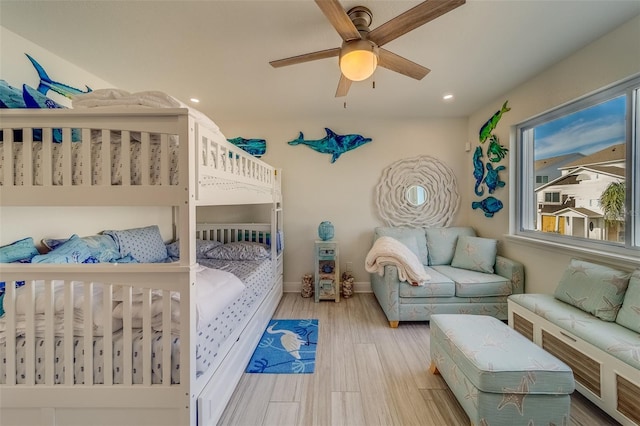 bedroom featuring ceiling fan and light hardwood / wood-style floors