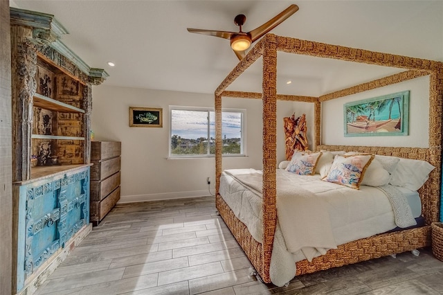 bedroom featuring hardwood / wood-style flooring and ceiling fan