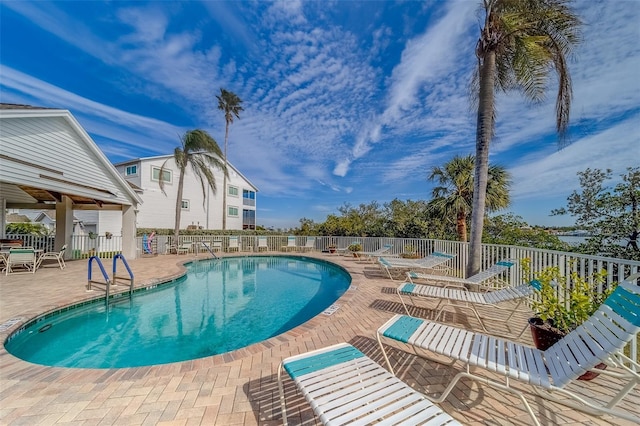 view of swimming pool with a patio area